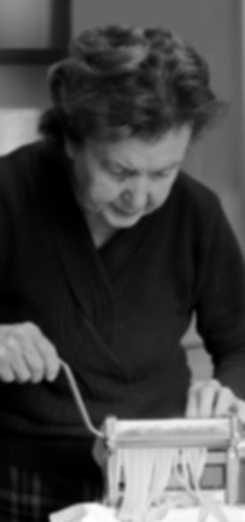 Elderly Woman Making Pasta