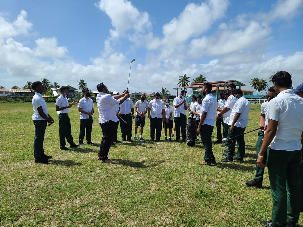 PE Teacher Amitabh Bisnauth and students in golf lesson