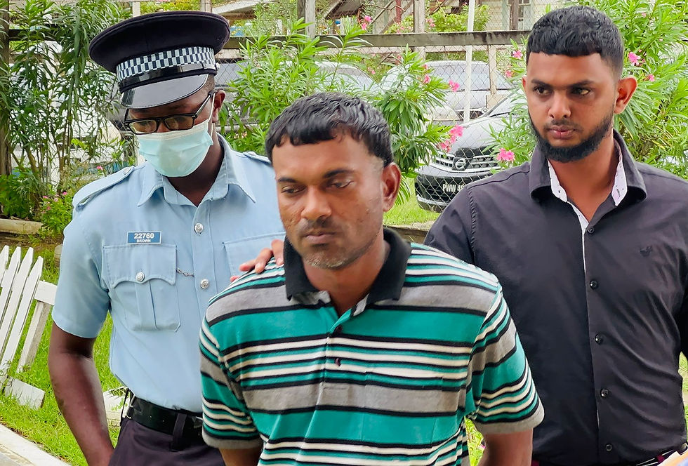 Accused: Mahendra Paltoo (centre)