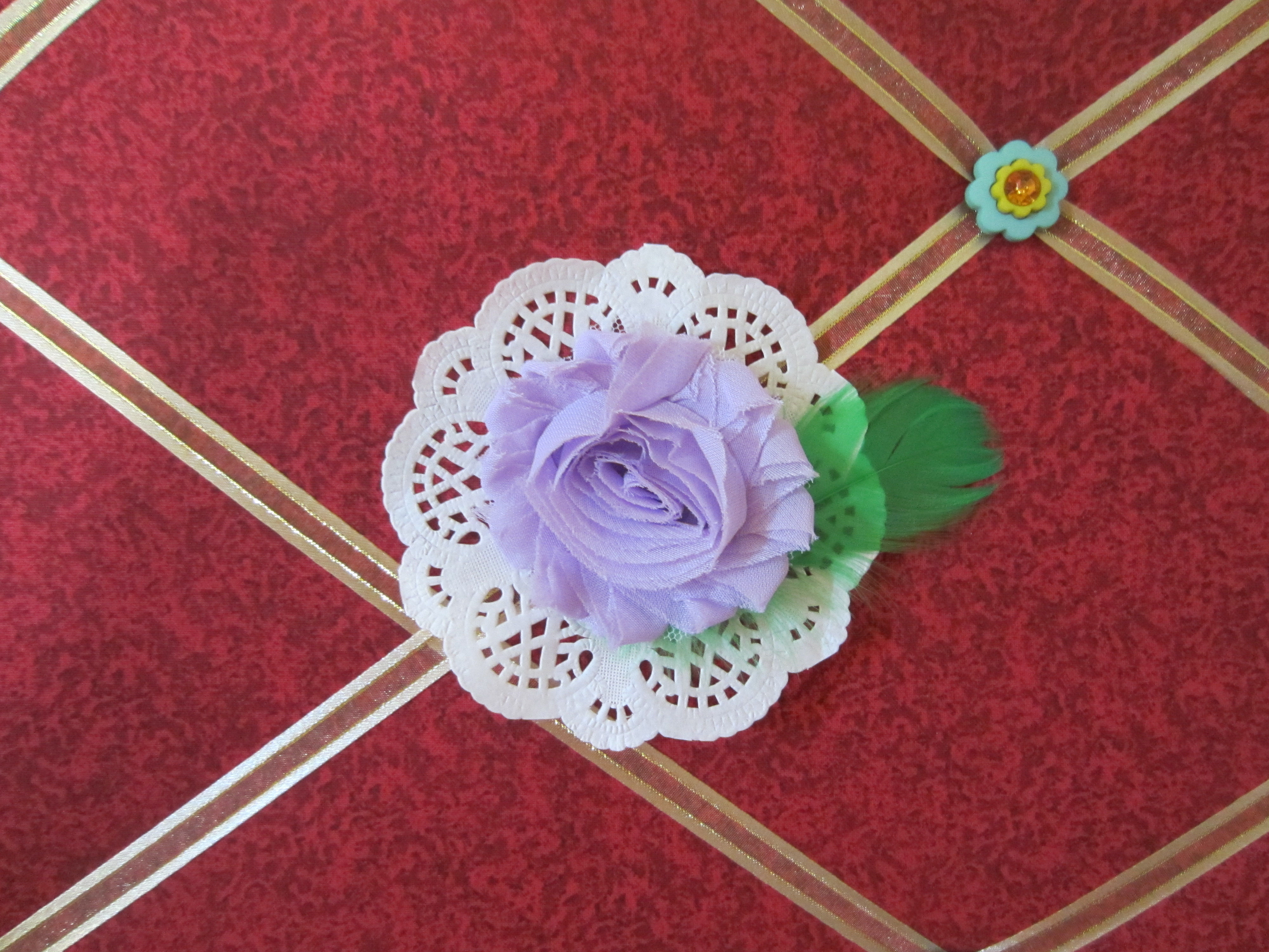 Lilac Fabric Flower on White Doily
