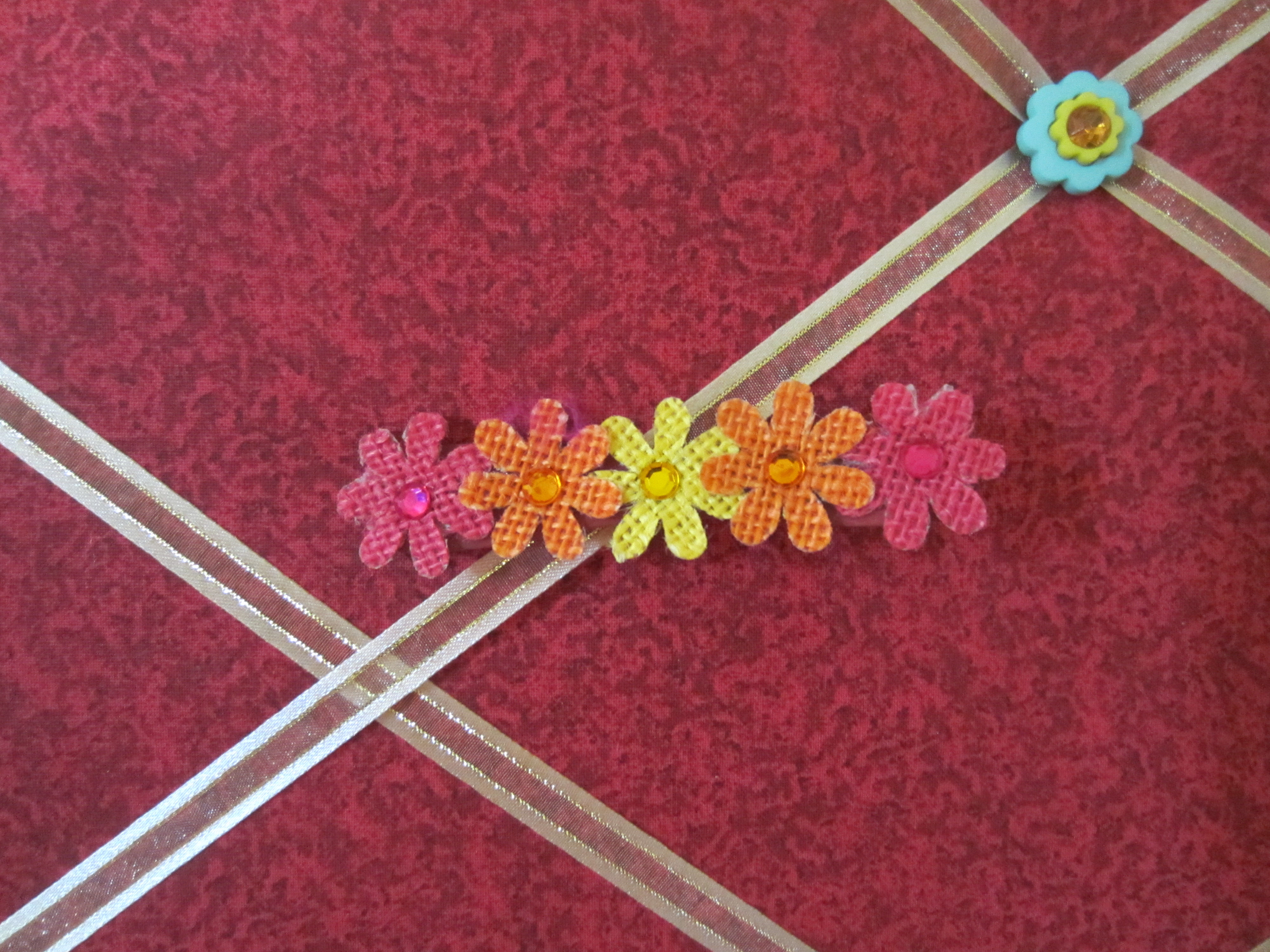 Pink, Orange, and Yellow Flowers in a Row