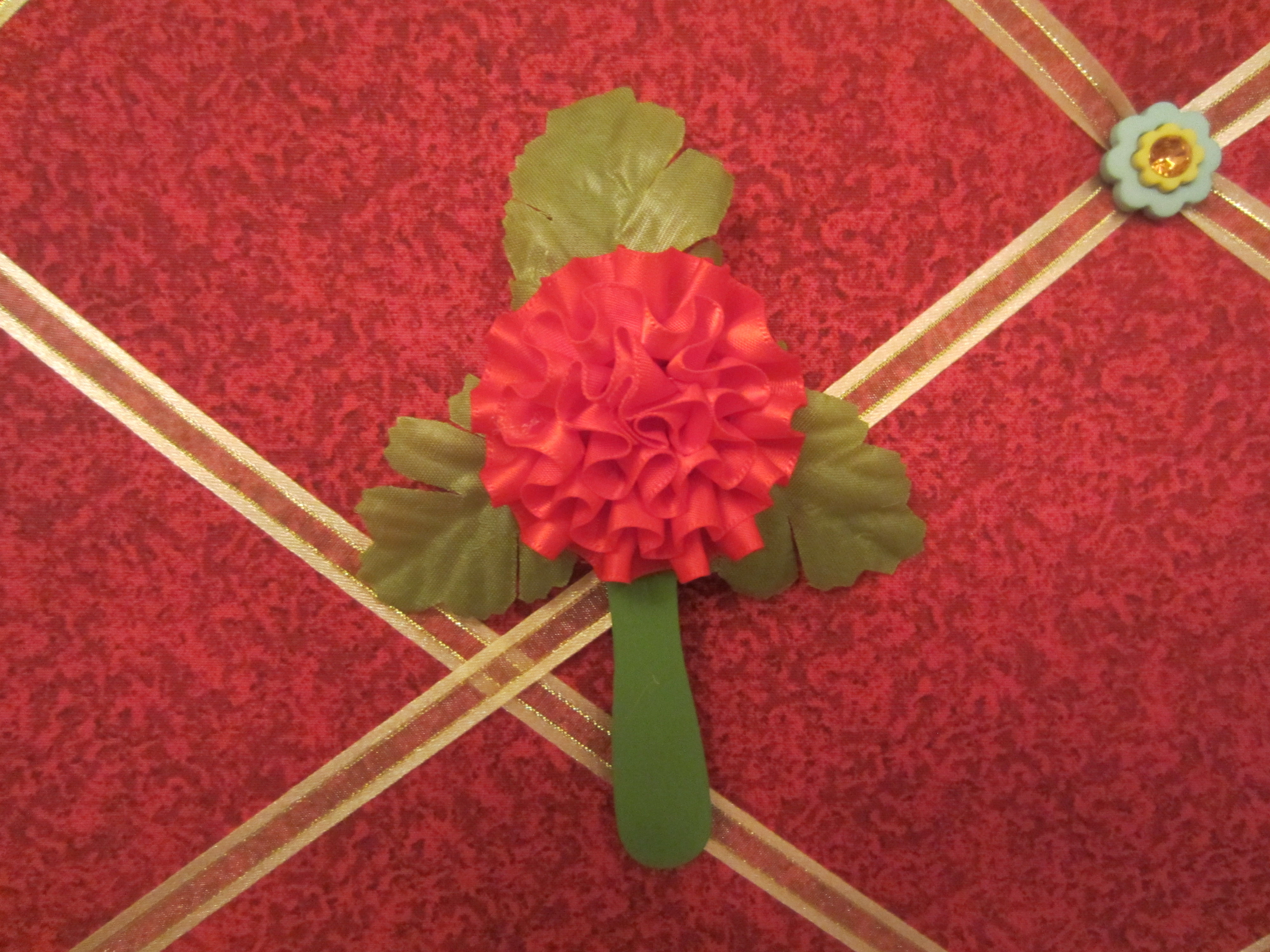 Red Carnation on a Stick With Leaves