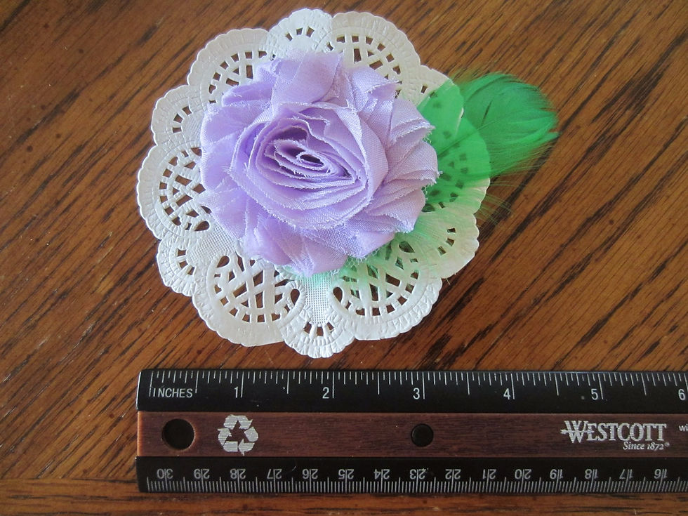 Thumbnail: Lilac Fabric Flower on White Doily