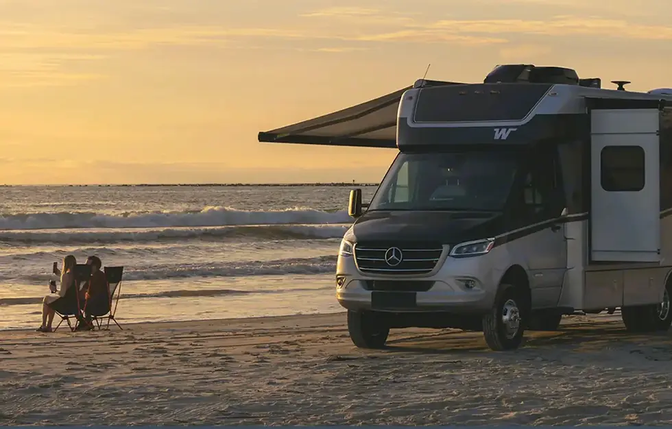 Mercedes RV on beach.webp