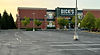 Exterior view of DICK'S Sporting Goods store with empty parking lot