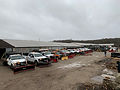 Fleet of snowplows parked outside Woodvalleycontractor