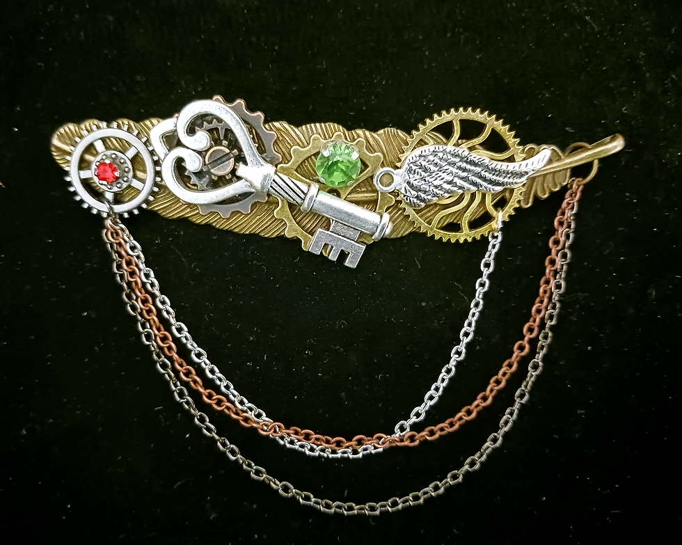 broche steampunk plume et chaînes