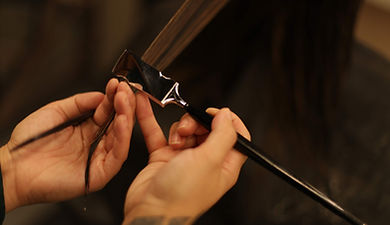 hair professional using cutting tool