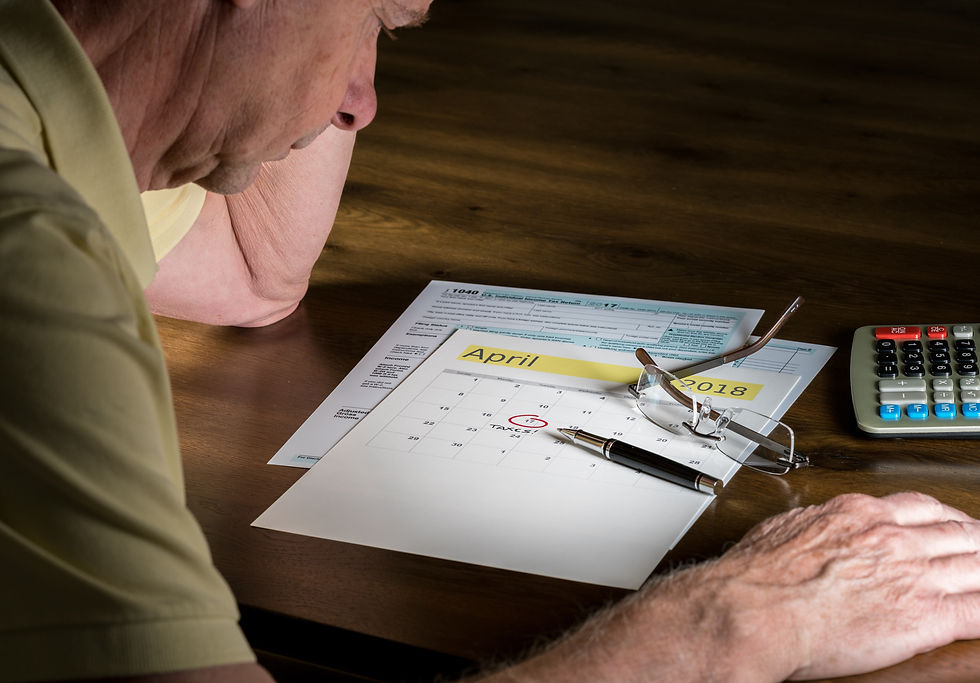 senior man with pen calendar table