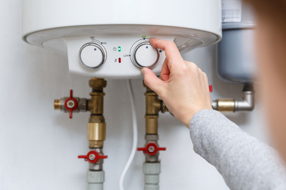 hand puts thermostat electric water heater boiler economy mode household enegry saving equipment