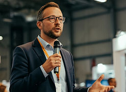man with glasses having speech