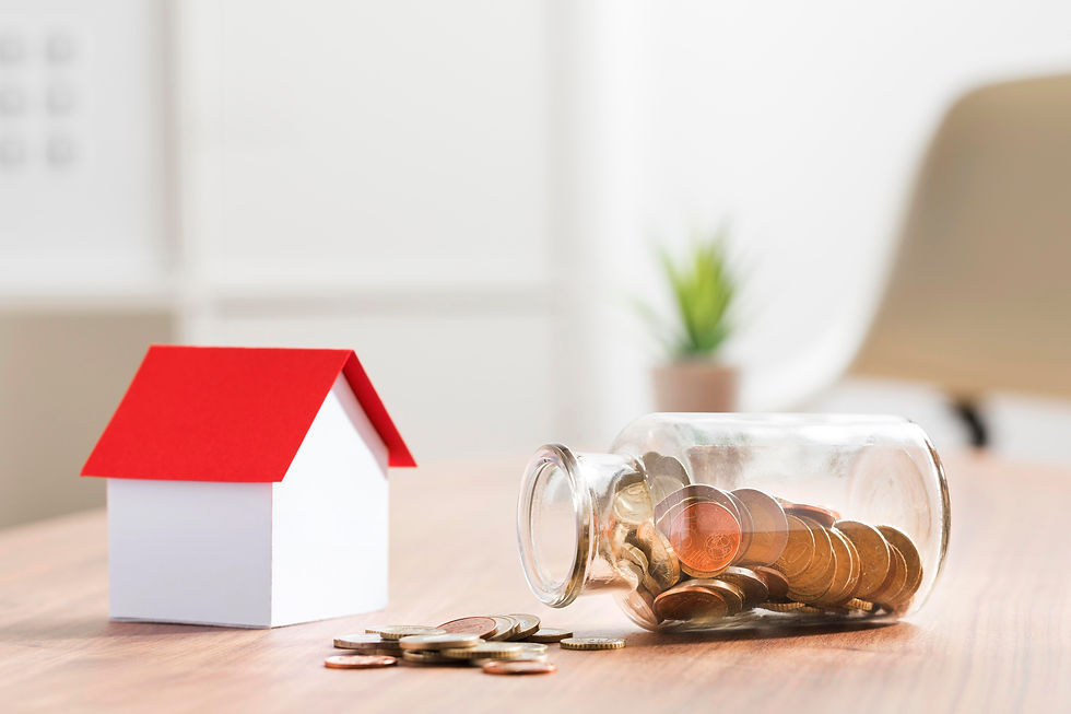 miniature bank with coins jar beside