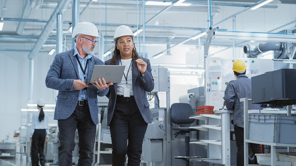 two people visiting a manufacturing company