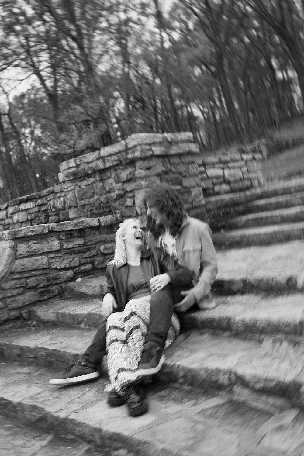 Couple sharing a tender moment on stone steps