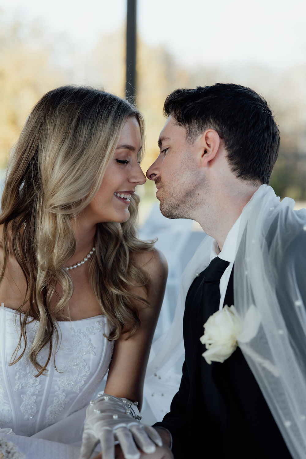 Bride and groom nose to nose, celebrating their Analea wedding