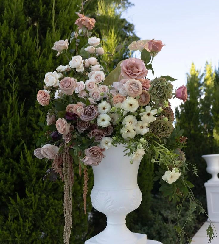 Elegant event floral design in white urn