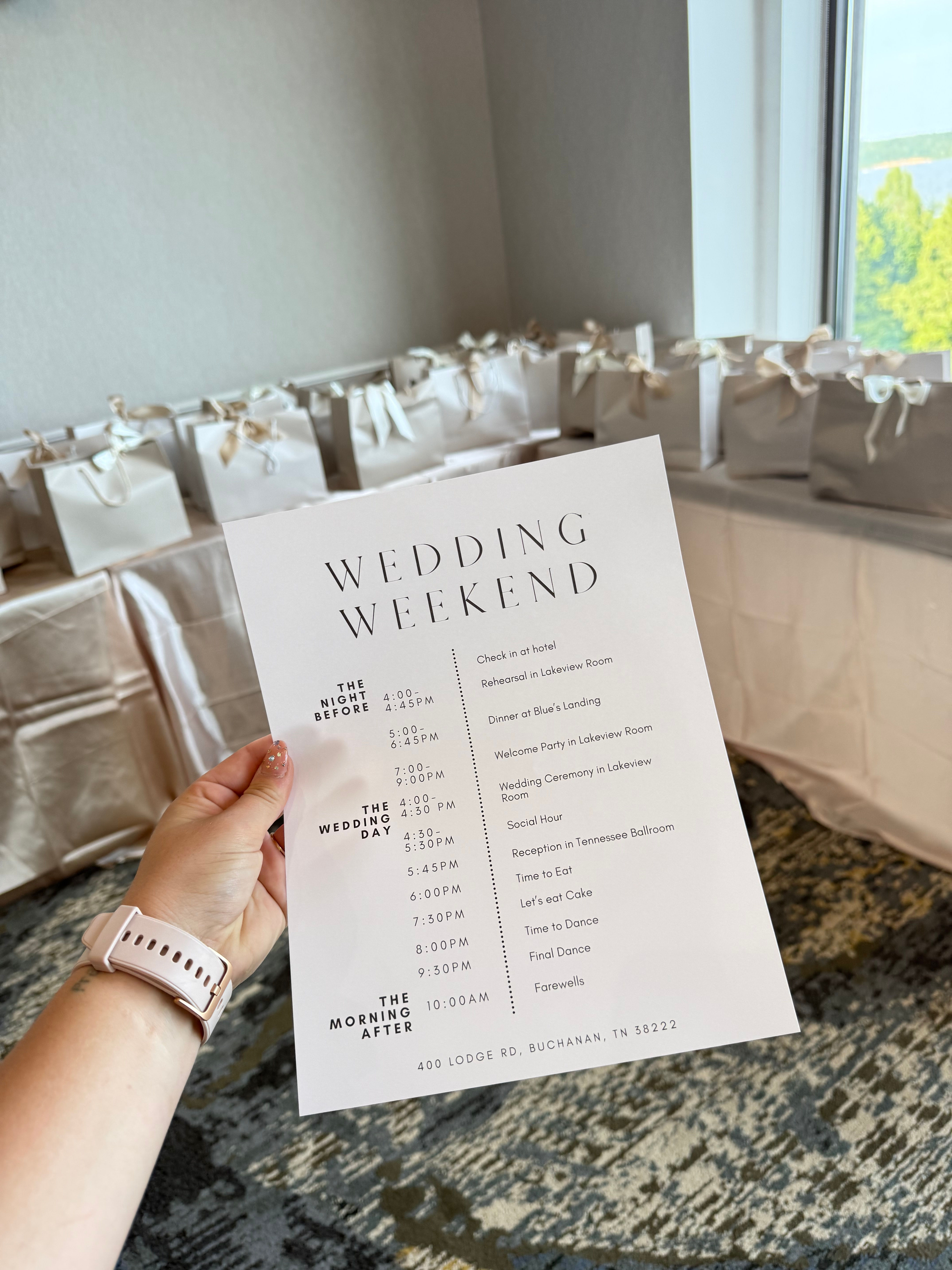 Wedding Weekend itinerary held before rows of gift bags.