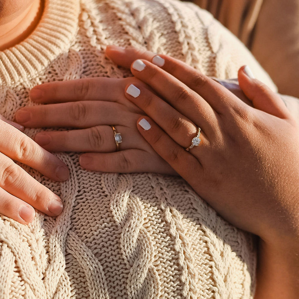 Engagement rings on couple's hands, Analea Wedding Co.