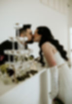 Couple kissing behind a champagne tower event rental West Virginia