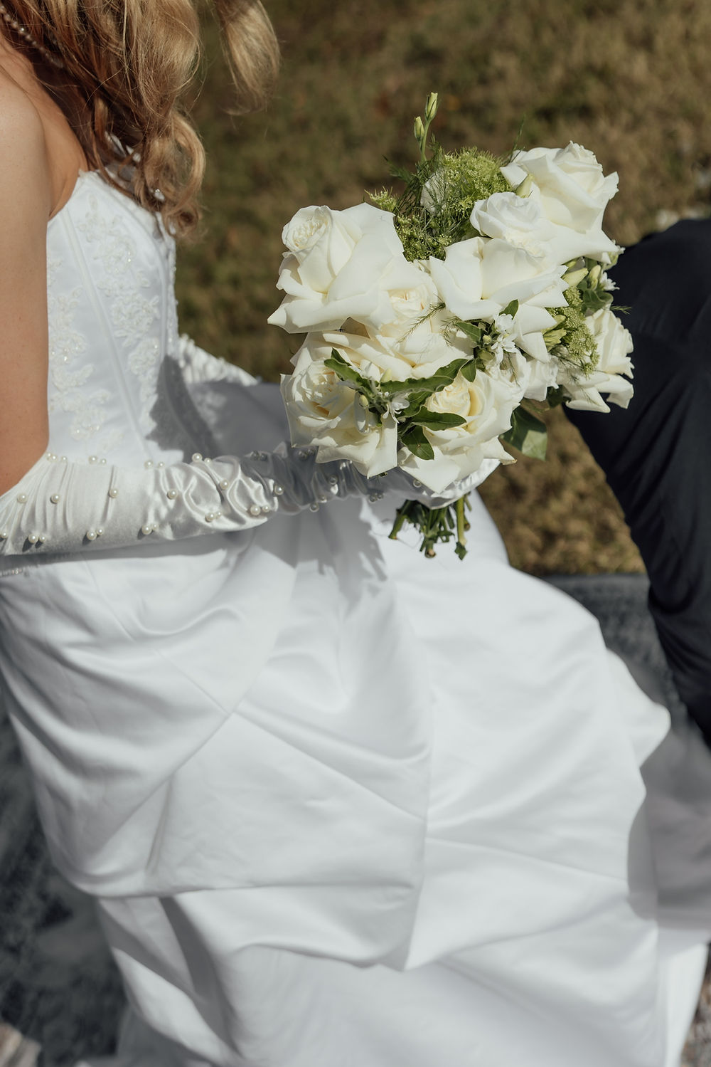 Bride holding white bouquet, analea wedding co.