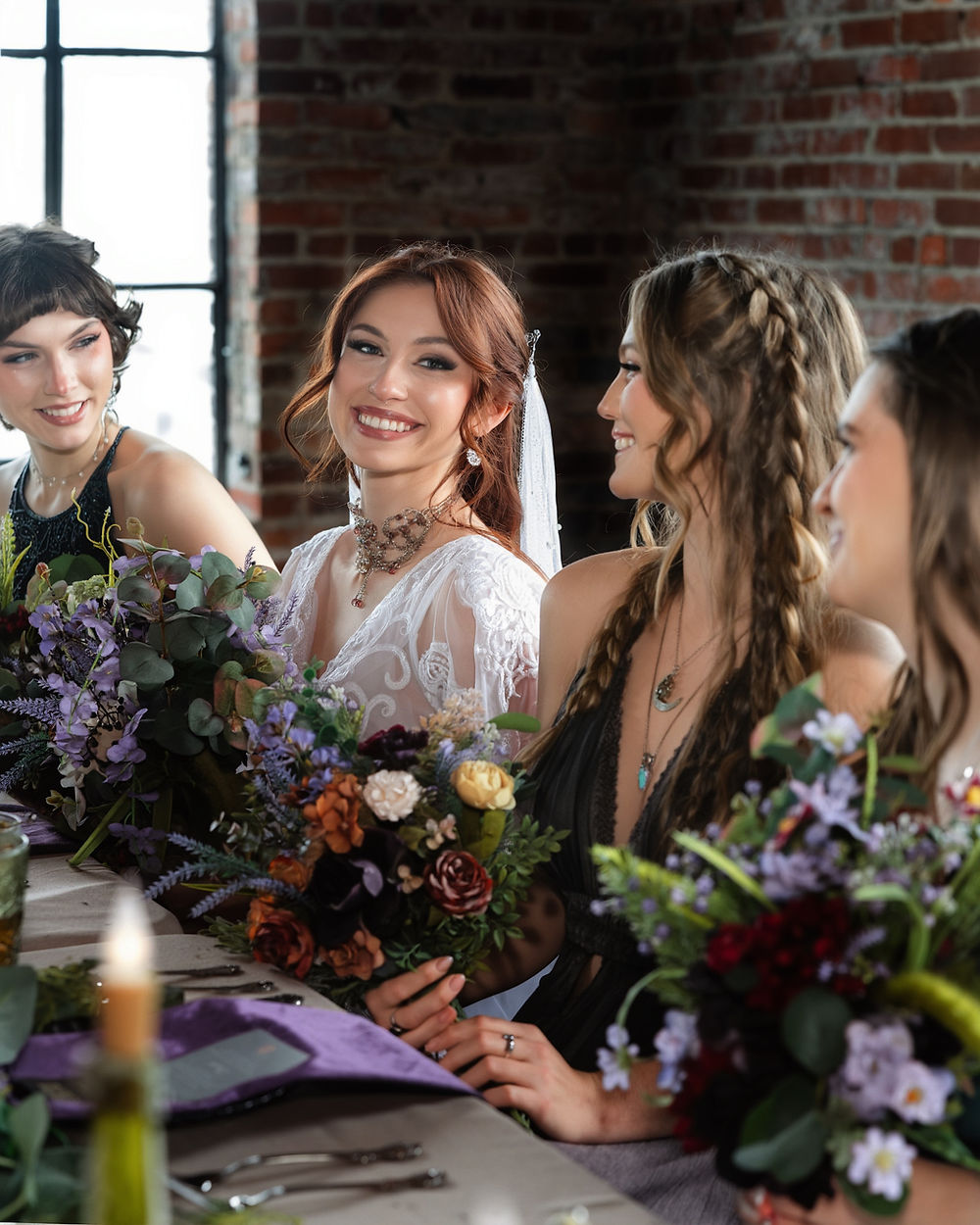 Smiling bride and bridesmaids with bouquets at an Analea wedding.