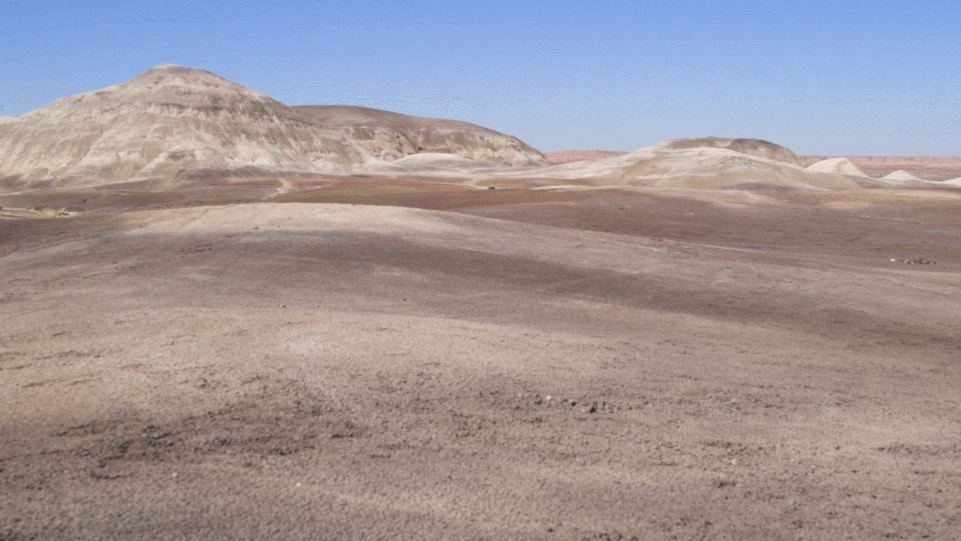 A beautiful valley hidden in the middle of nowhere. The multi-colored hills and open land create a cinematic landscape comparable to another planet. 17 miles north of Burnside, AZ, 25 miles south of Chinle, AZ.