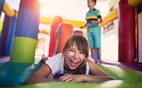 Children Playing in Bouncy Castle