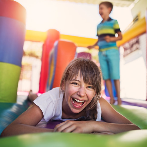 Children Playing in Bouncy Castle