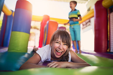 Children Playing in Bouncy Castle