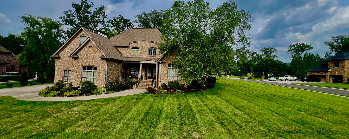 Lawn mowing service in Chattanooga front yard.