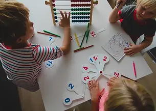 kids practicing numbers.jpg