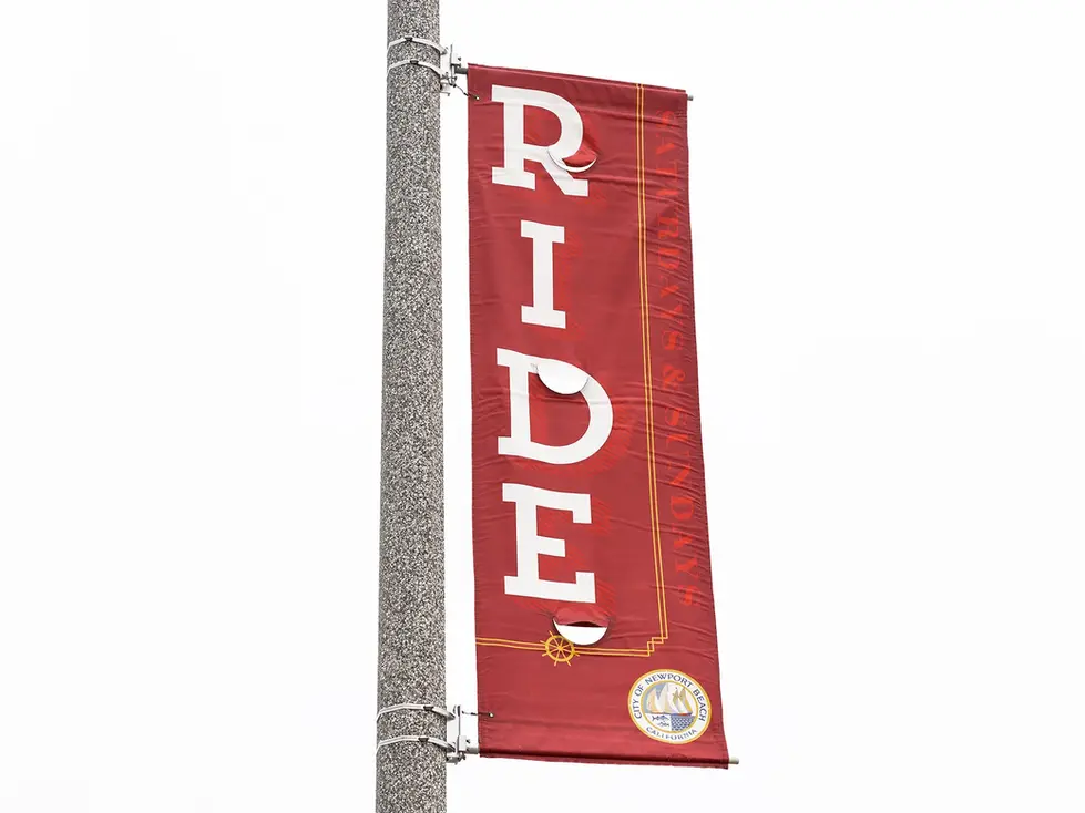 Red street banner with the word "RIDE" vertically.
