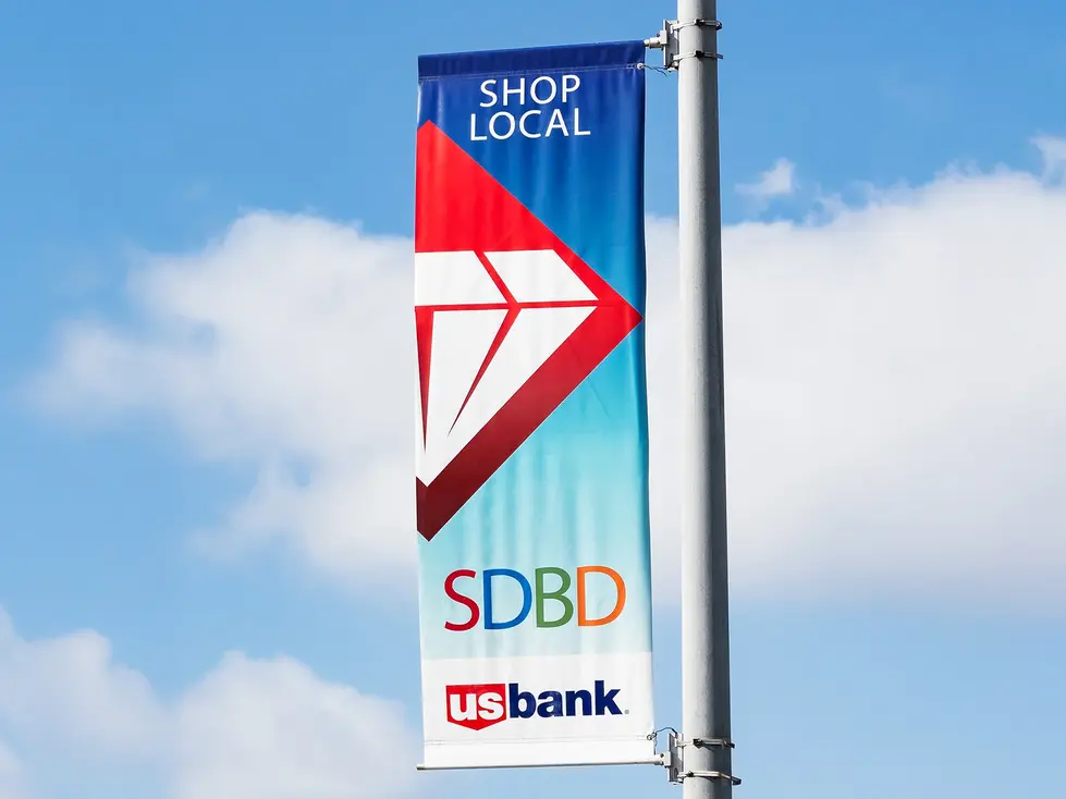 Banner promoting local shopping with US Bank logo.