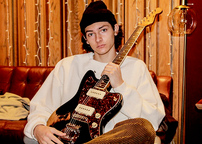 Jack Landess posing with a guitar in Nashville.