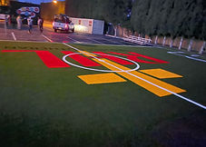 turf sports field with school logo