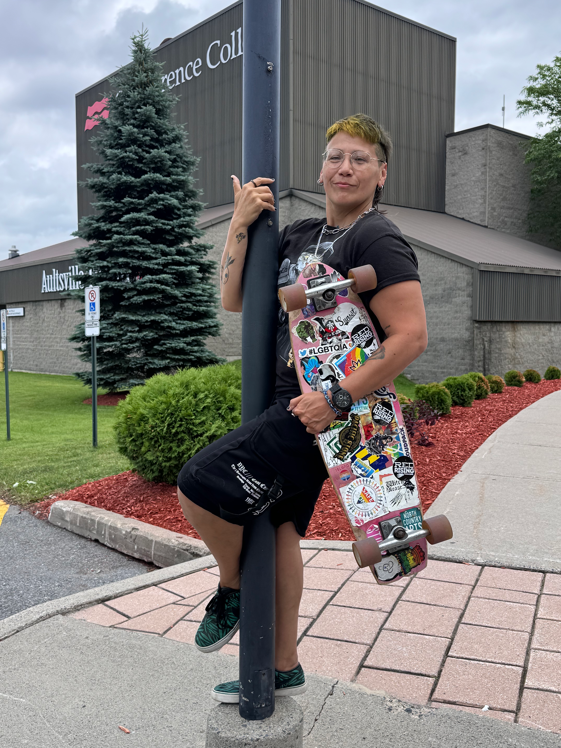 Kit Thomas, Two-Spirit Indigenous artist, skateboarding while exploring Canada.