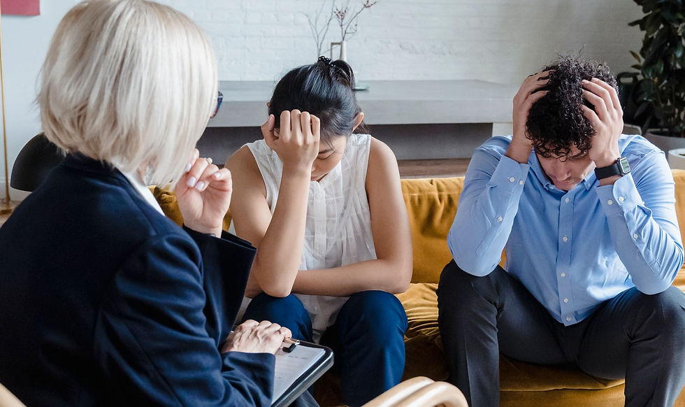 A couple in a virtual counseling session with their therapist