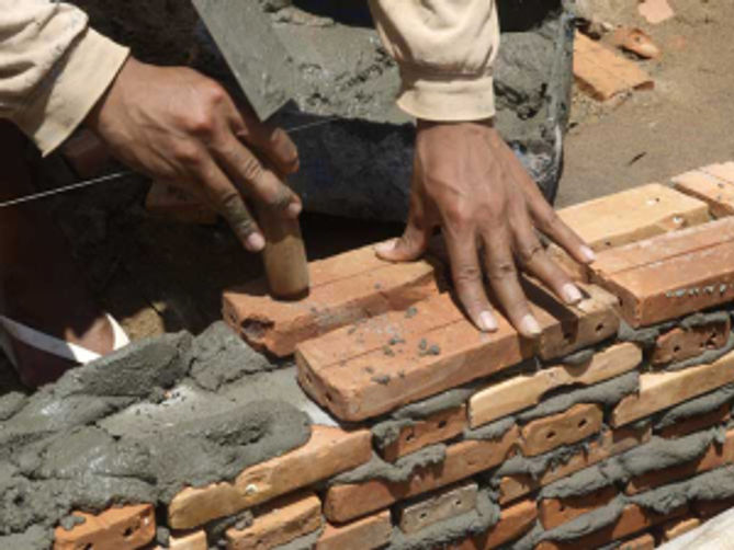 The first bricks being laid