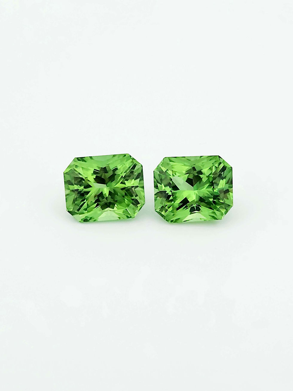 Thumbnail: A Pair of Natural Eye-Clean Green Burma Peridot [10.15ct & 10.45ct]
