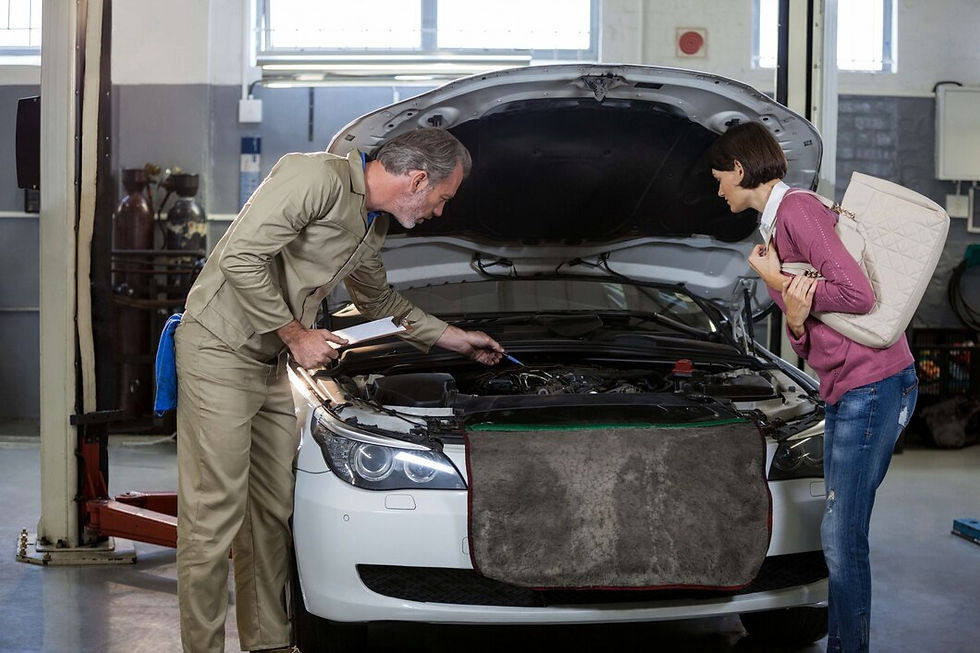 mechanic-showing-customer-problem-with-car_1170-1485.jpg