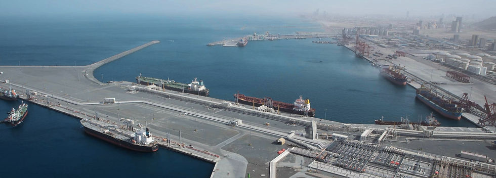 Aerial view of a large port with ships and cargo containers.