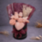 Bouquet de fleurs rosée dans un pot noir