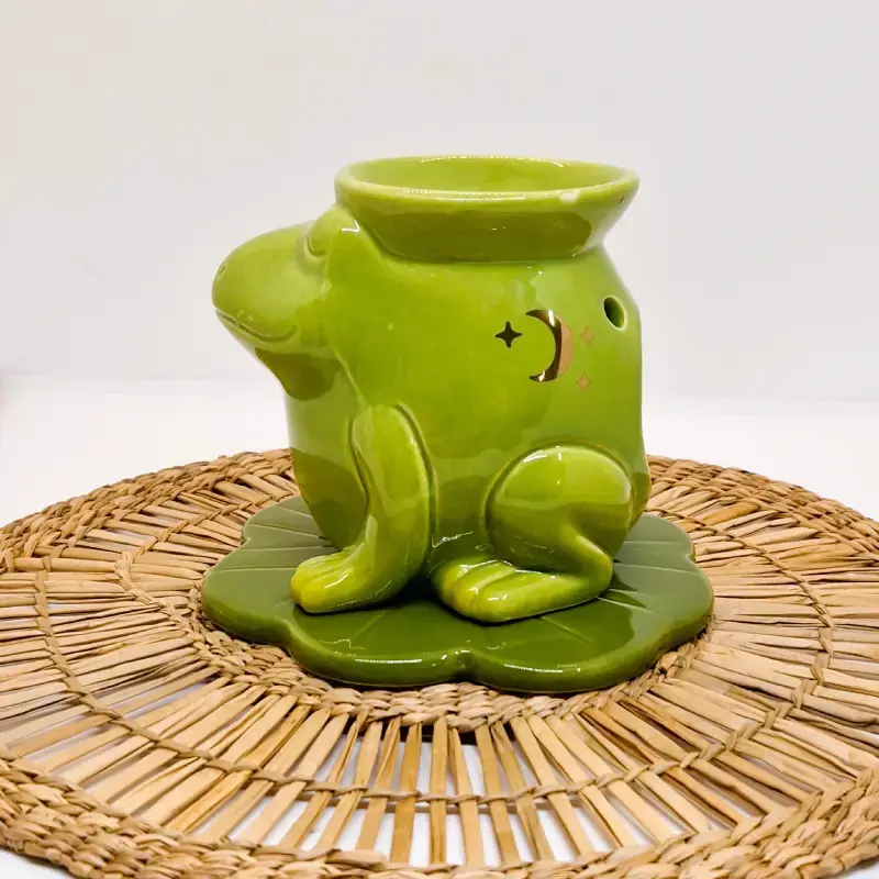 Miniature : Bruleur pour fondant parfumé en forme de grenouille vue de côté.