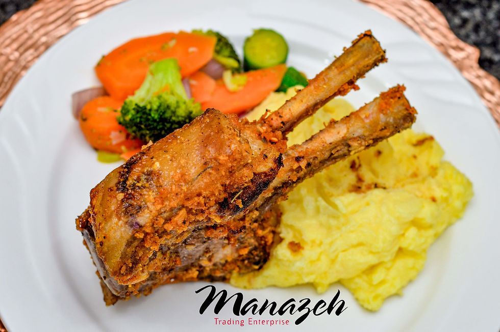 Event catering meal featuring grilled pork chops with mashed potatoes and vegetables by Manazeh Catering in Gauteng.