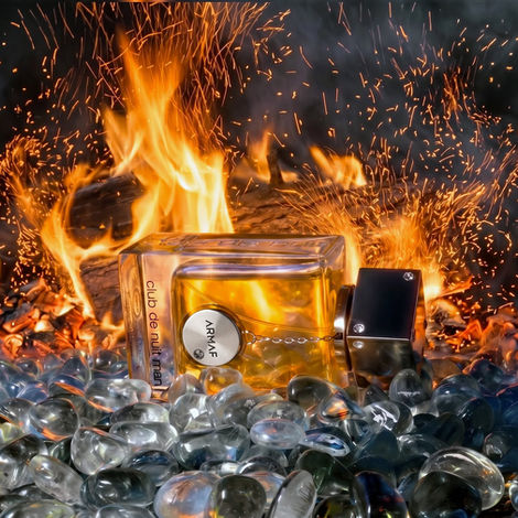 mens cologne nightclub by armaf on hot coals and in the fire with spakrs flying shot by Calgary product photographer