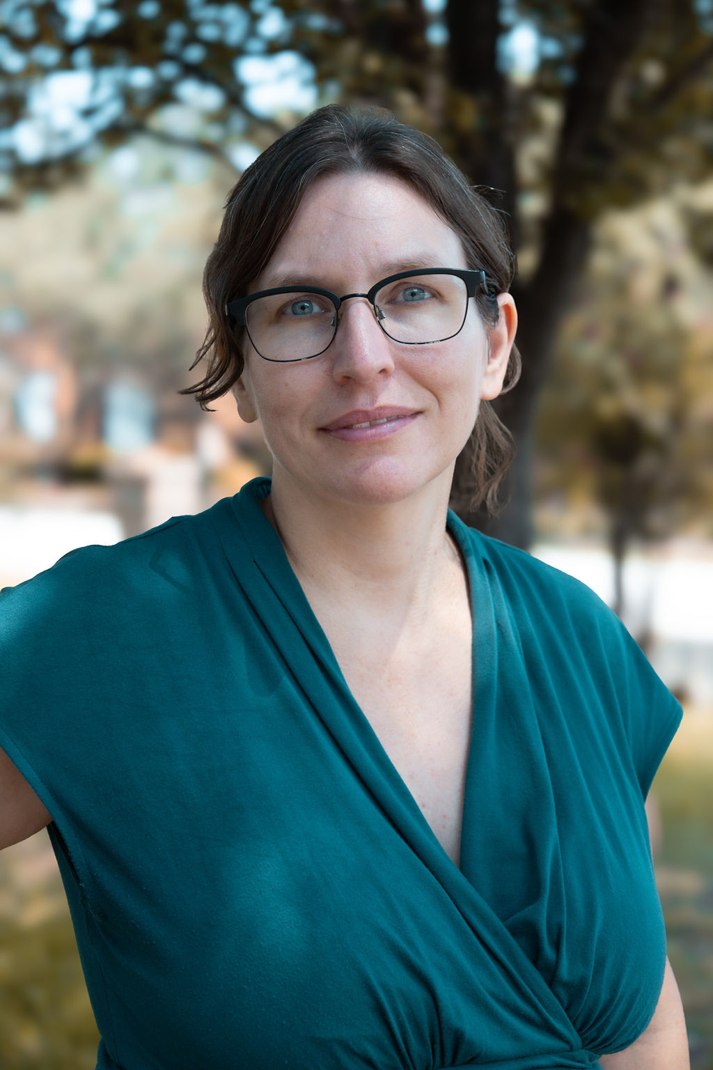 Financial coach Sabrina Alton of Insight Financial Coaching smiling outdoors