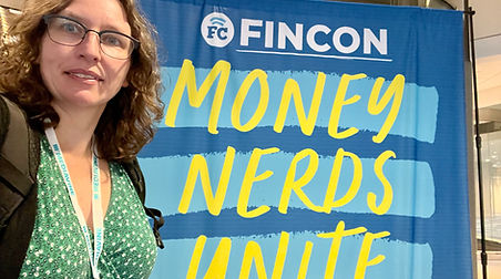 Financial-Coach-Sabrina in front of a sign that says Money Nerds Unite