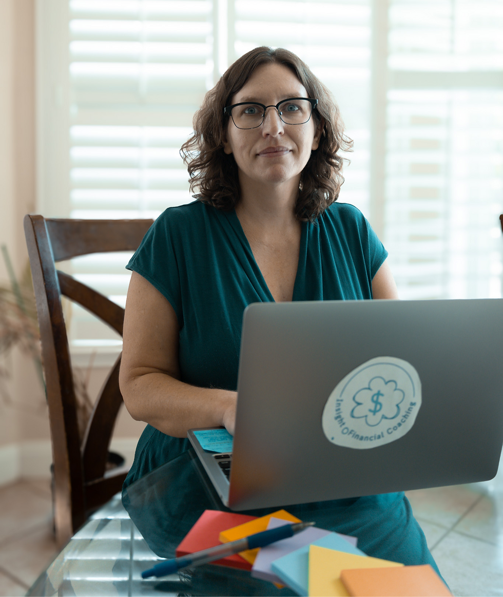 A midlife woman pausing before she looks at her finances.