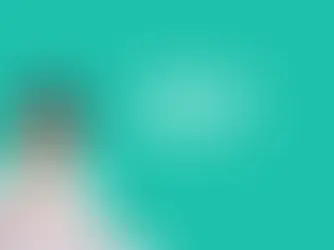 A young girl smiling while holding a paintbrush, sitting at a desk, next to the text “What Is Literacy, Really?” on a teal background. Image for The Learning Room’s blog explaining what literacy truly means and how academic coaching builds vocabulary, background knowledge, and strong reading skills.