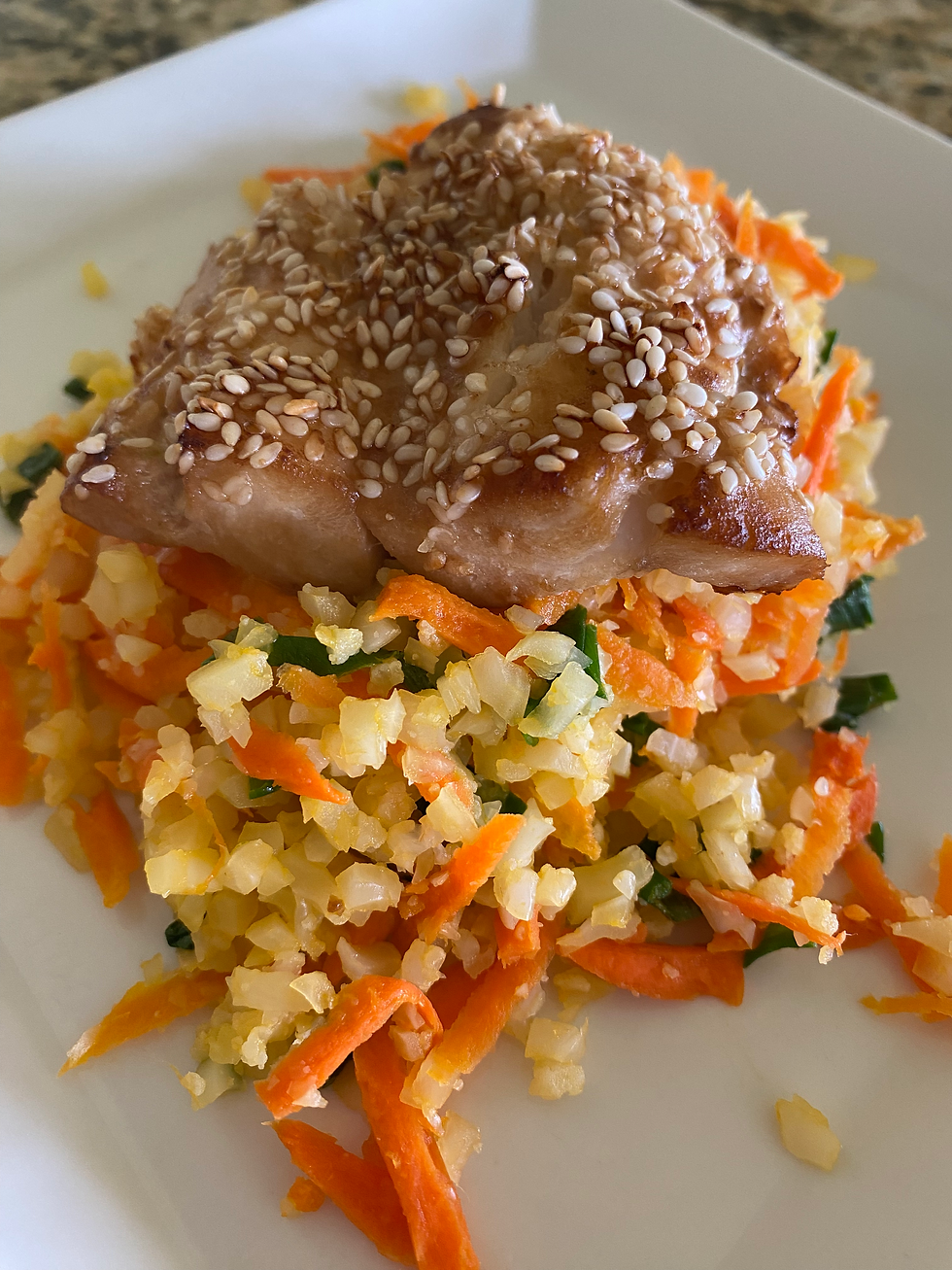 Baked Miso Orange Roughy on a bed of Cauliflower Rice with carrots and scallions